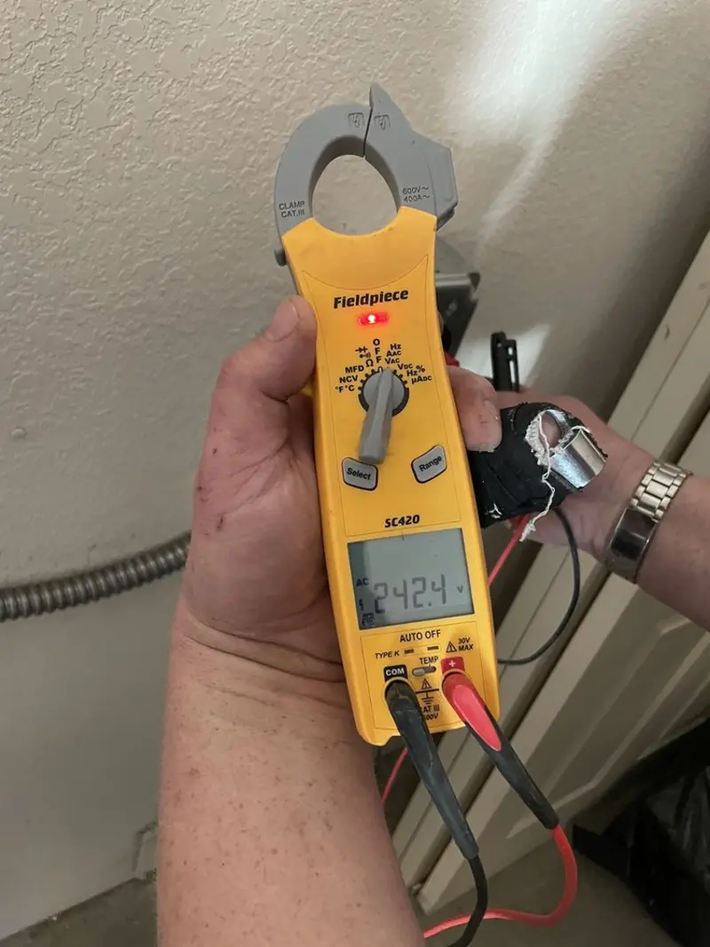 Voltage testing with clamp meter during Ceiling Fan Installation in North Salem